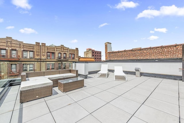 view of patio / terrace featuring a view of city and an outdoor living space