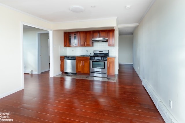 kitchen featuring a baseboard heating unit, appliances with stainless steel finishes, tasteful backsplash, dark hardwood / wood-style flooring, and sink