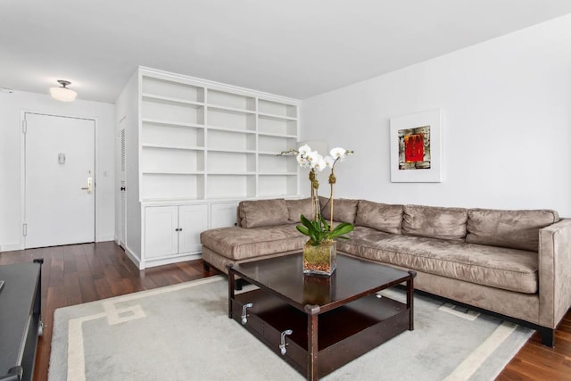 living room with dark hardwood / wood-style floors