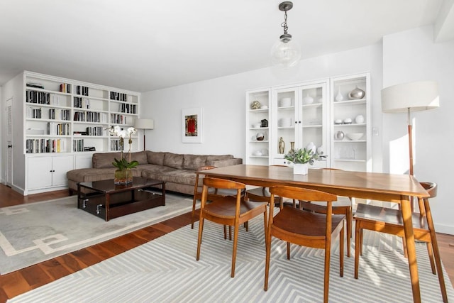 dining room with wood-type flooring