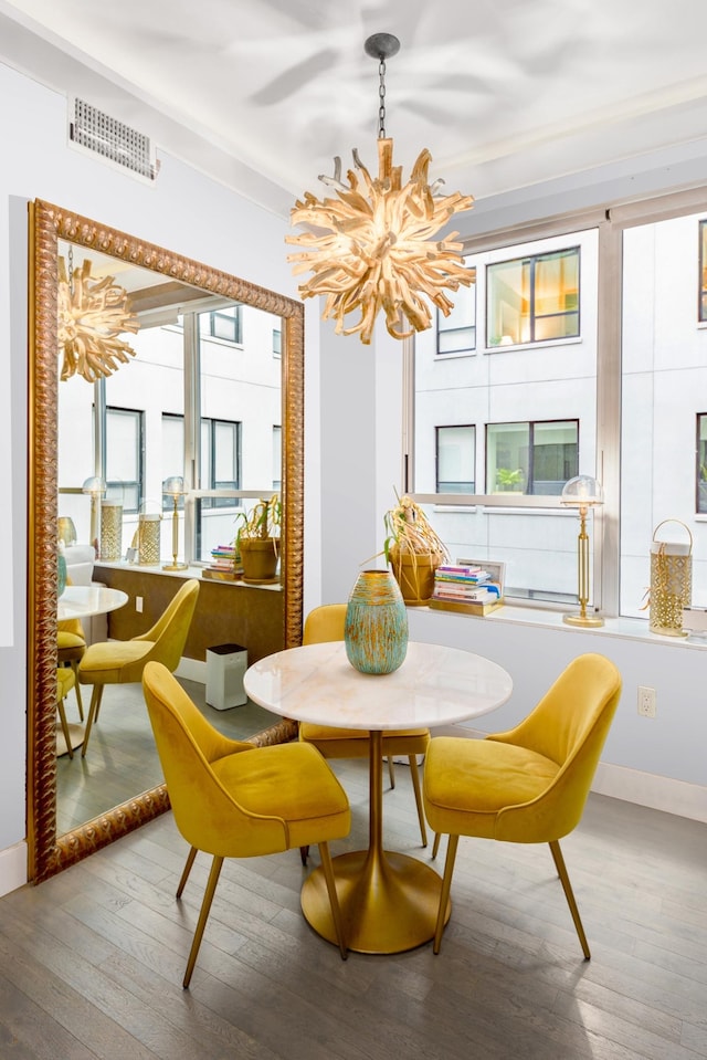 416 W 52nd St Unit 305, New York City, NY 10019 - dining space with a chandelier and wood-type flooring