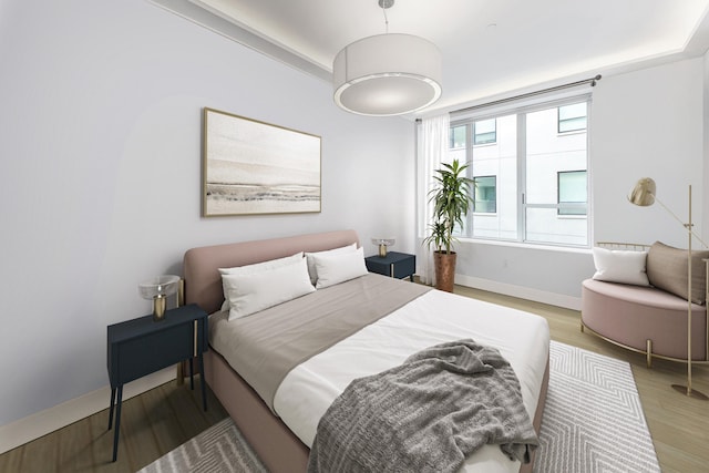 416 W 52nd St Unit 305, New York City, NY 10019 - bedroom with light wood-style flooring and baseboards