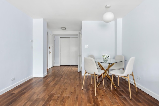 435 E 77th St Unit 10G, New York City, NY 10021 - dining space with dark wood-style floors and baseboards
