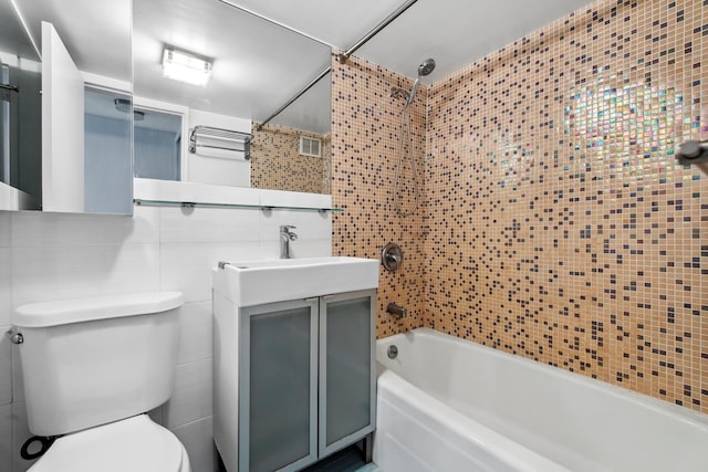 435 E 77th St Unit 10G, New York City, NY 10021 - full bath featuring tile walls, shower / bathtub combination, toilet, and vanity