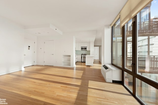 unfurnished room featuring light wood-type flooring