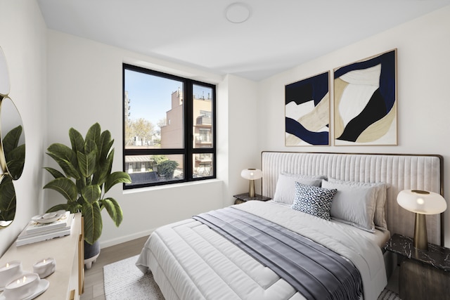 bedroom with hardwood / wood-style flooring