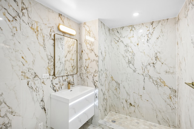 229 Withers St Unit 2B, New York City, NY 11211 - bathroom with tile walls, marble finish floors, a marble finish shower, vanity, and recessed lighting
