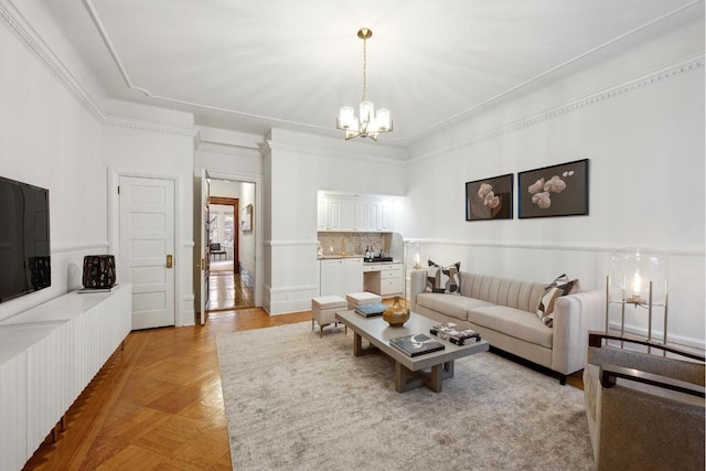 living room with light parquet flooring and an inviting chandelier