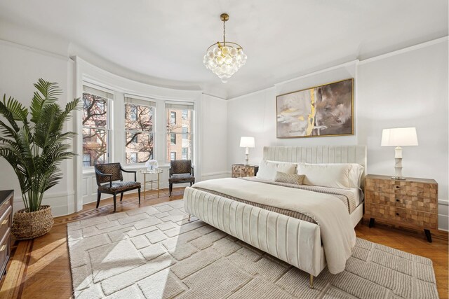 dining area with light parquet floors, french doors, wooden walls, and a notable chandelier