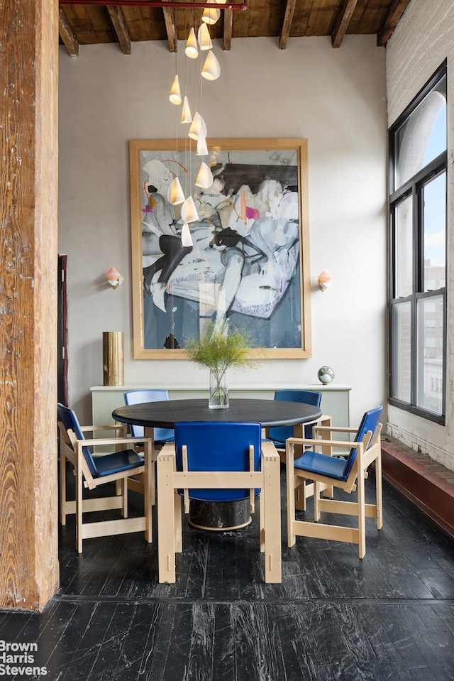 dining area with wood ceiling and beam ceiling