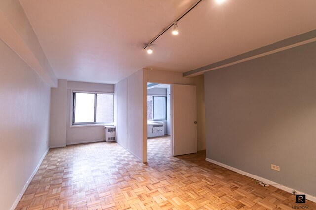 bonus room featuring baseboards