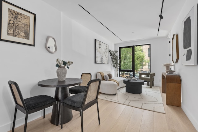 dining space with light wood-type flooring