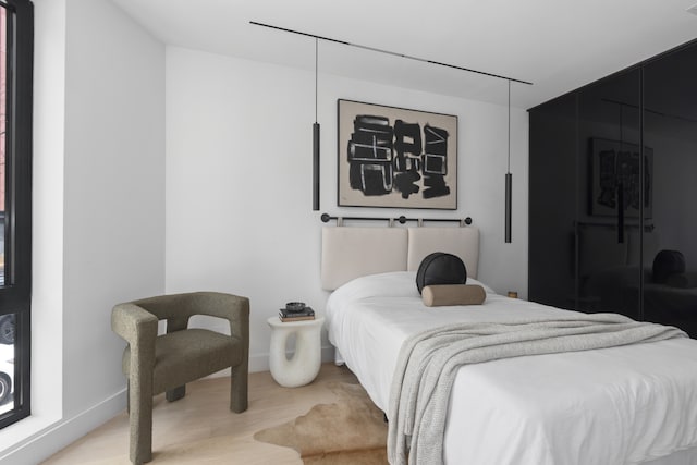 bedroom featuring wood finished floors