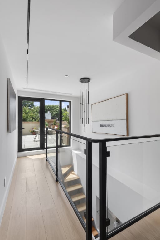 staircase with hardwood / wood-style flooring and french doors