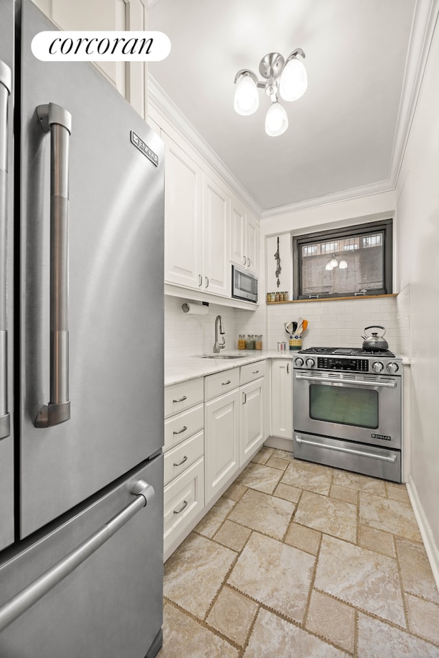 kitchen featuring a sink, stainless steel appliances, light countertops, and ornamental molding