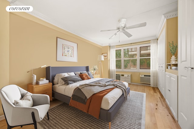 bedroom featuring crown molding, ceiling fan, visible vents, and light wood-type flooring