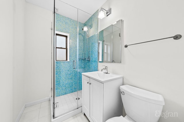 bathroom with a shower with shower door, tile patterned floors, toilet, and vanity