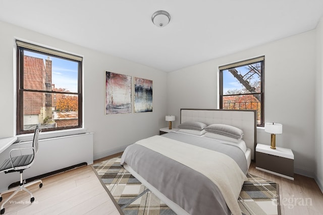 bedroom with light hardwood / wood-style flooring