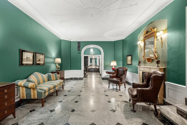 sitting room with ornamental molding