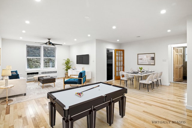 rec room featuring radiator heating unit, recessed lighting, light wood-type flooring, and ceiling fan