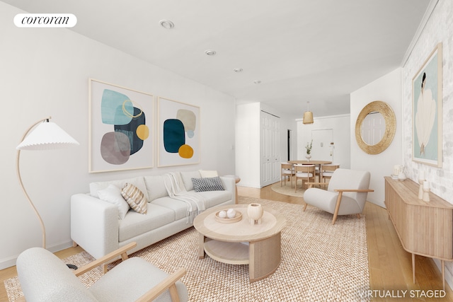 living area featuring visible vents and light wood-type flooring