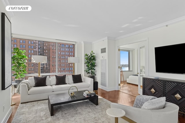 living area with visible vents, baseboards, and ornamental molding