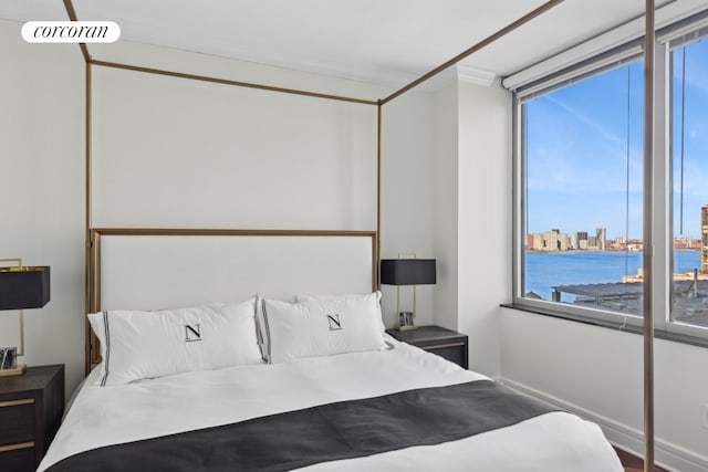 bedroom featuring visible vents and a city view