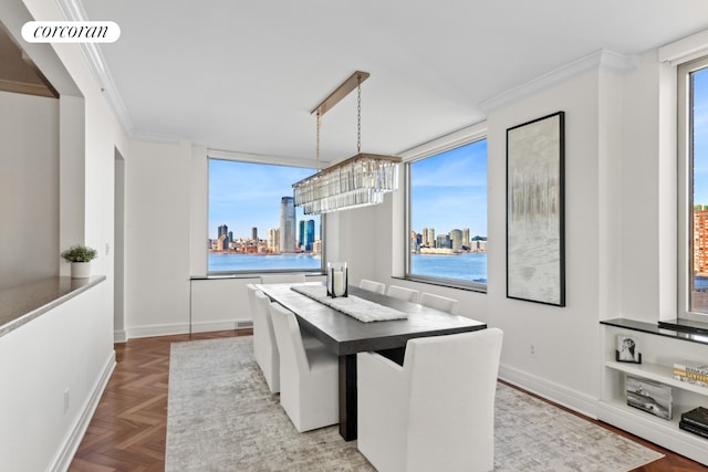 dining area with a view of city, an inviting chandelier, ornamental molding, and visible vents