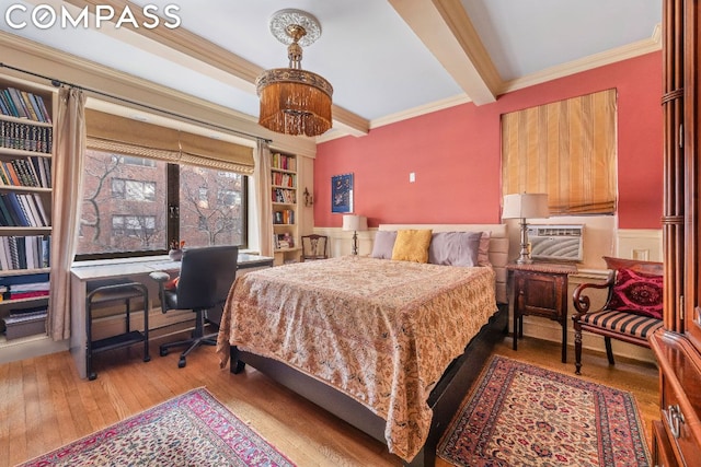 bedroom with crown molding, light hardwood / wood-style flooring, and beamed ceiling