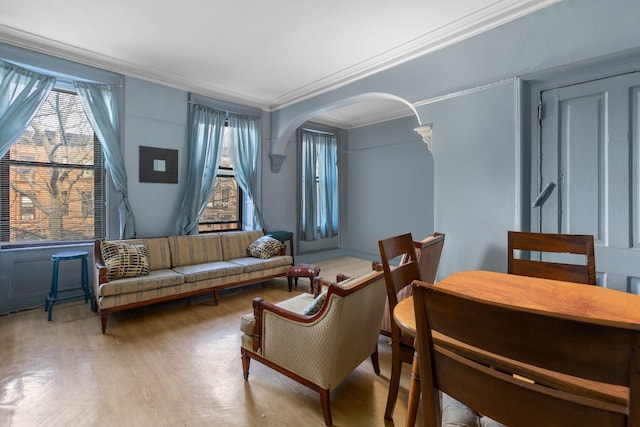 464 5th St, New York City, NY 11215 - living area featuring crown molding, wood finished floors, and arched walkways