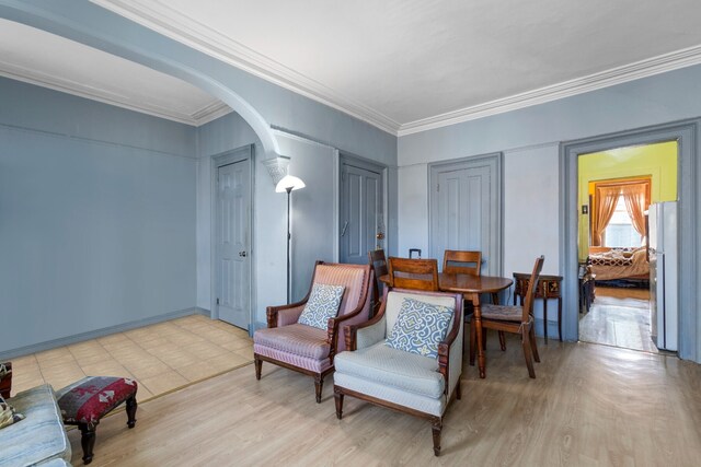 464 5th St, New York City, NY 11215 - living area with arched walkways, ornamental molding, and wood finished floors