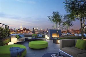 patio terrace at dusk featuring an outdoor living space with a fire pit