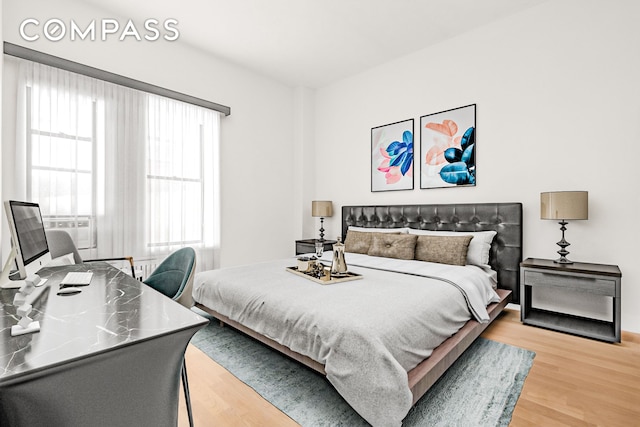 bedroom featuring light wood-style flooring