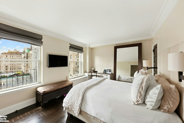 8 E 96th St Unit 14C, New York City, NY 10128 - bedroom with ornamental molding, baseboards, and dark wood finished floors