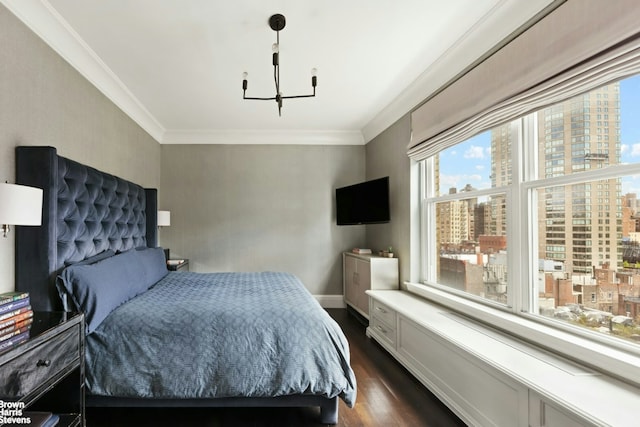 8 E 96th St Unit 14C, New York City, NY 10128 - bedroom with dark wood-style flooring, crown molding, baseboards, and a chandelier