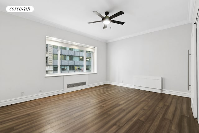 unfurnished room featuring ceiling fan, dark wood-type flooring, and ornamental molding