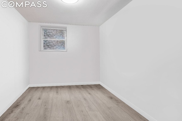 spare room with light wood-type flooring