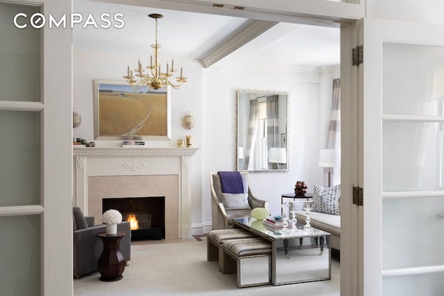 living area with beam ceiling, crown molding, a chandelier, and carpet