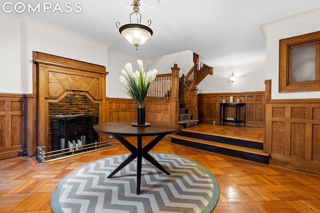 living area featuring a fireplace and parquet flooring