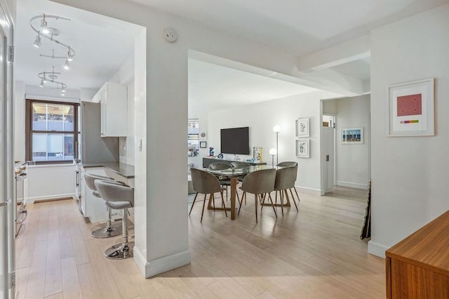 dining space with light wood-type flooring