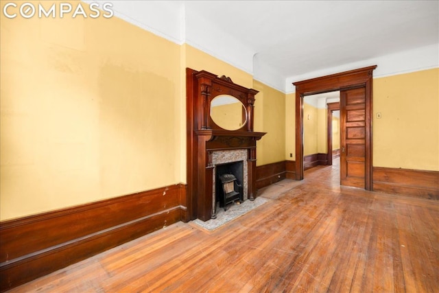 unfurnished living room featuring wood-type flooring