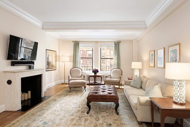 living room with wood-type flooring and ornamental molding