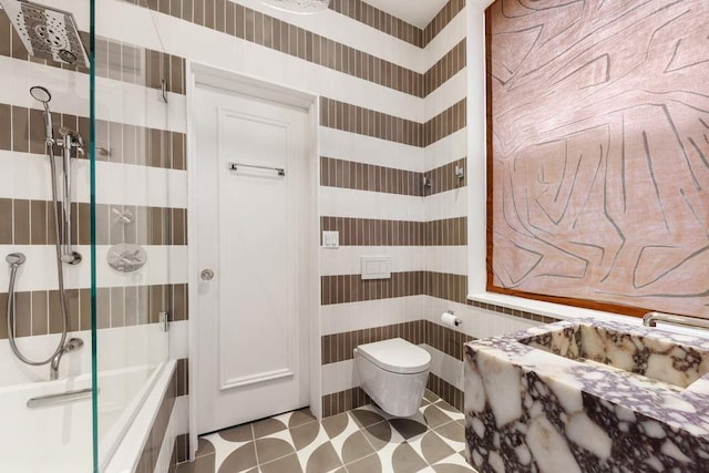 bathroom with toilet, walk in shower, tile patterned flooring, and wallpapered walls