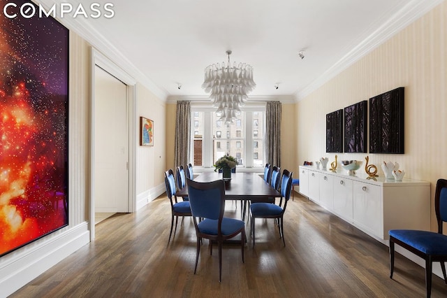 dining area featuring crown molding, a chandelier, and hardwood / wood-style flooring