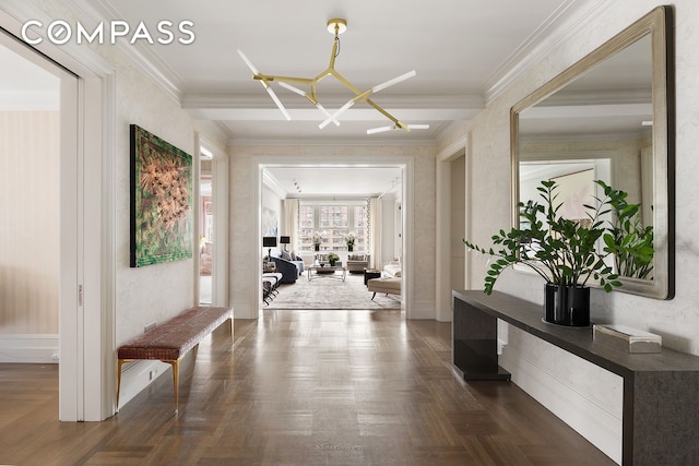 hall with a chandelier and crown molding