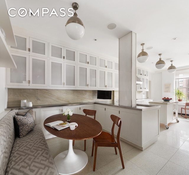 dining space with light speckled floor