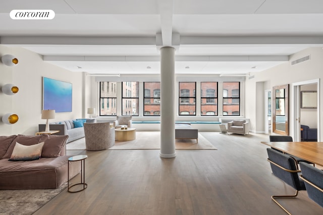 living room with hardwood / wood-style floors and beamed ceiling