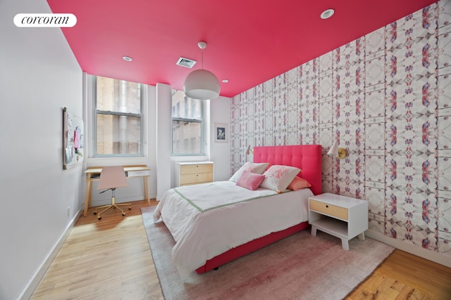 bedroom with light hardwood / wood-style flooring