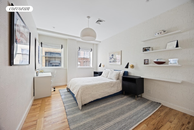 bedroom featuring hardwood / wood-style floors