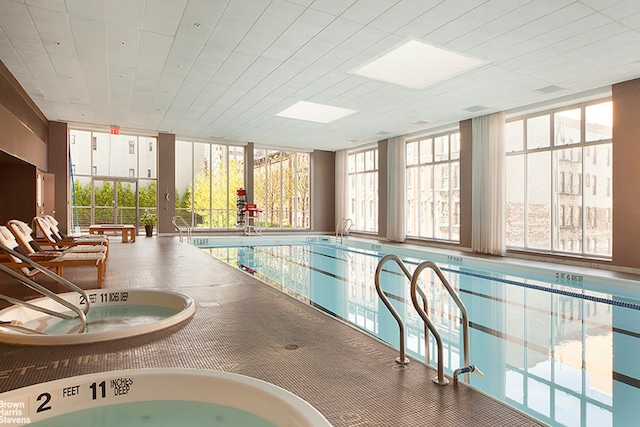 pool featuring an indoor hot tub